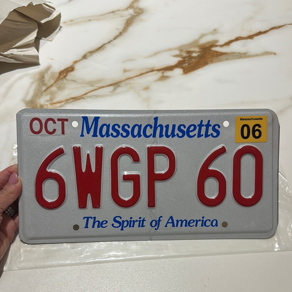 Massachusetts License Plate with Red and Blue Text